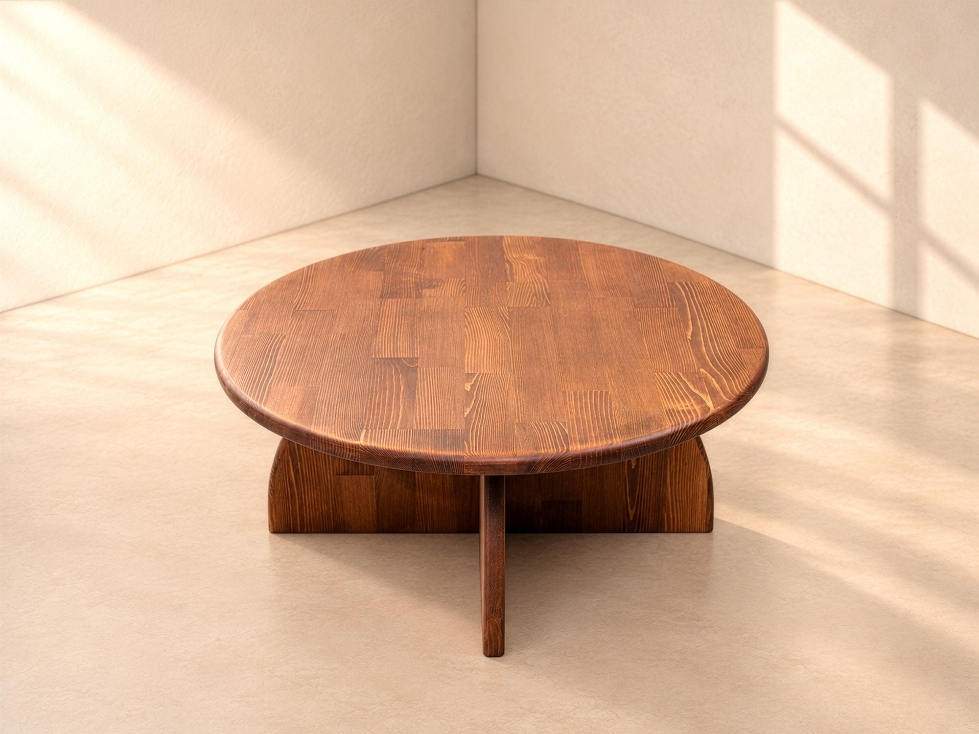 Vaha round solid wood coffee table with arched base, slightly raised angle