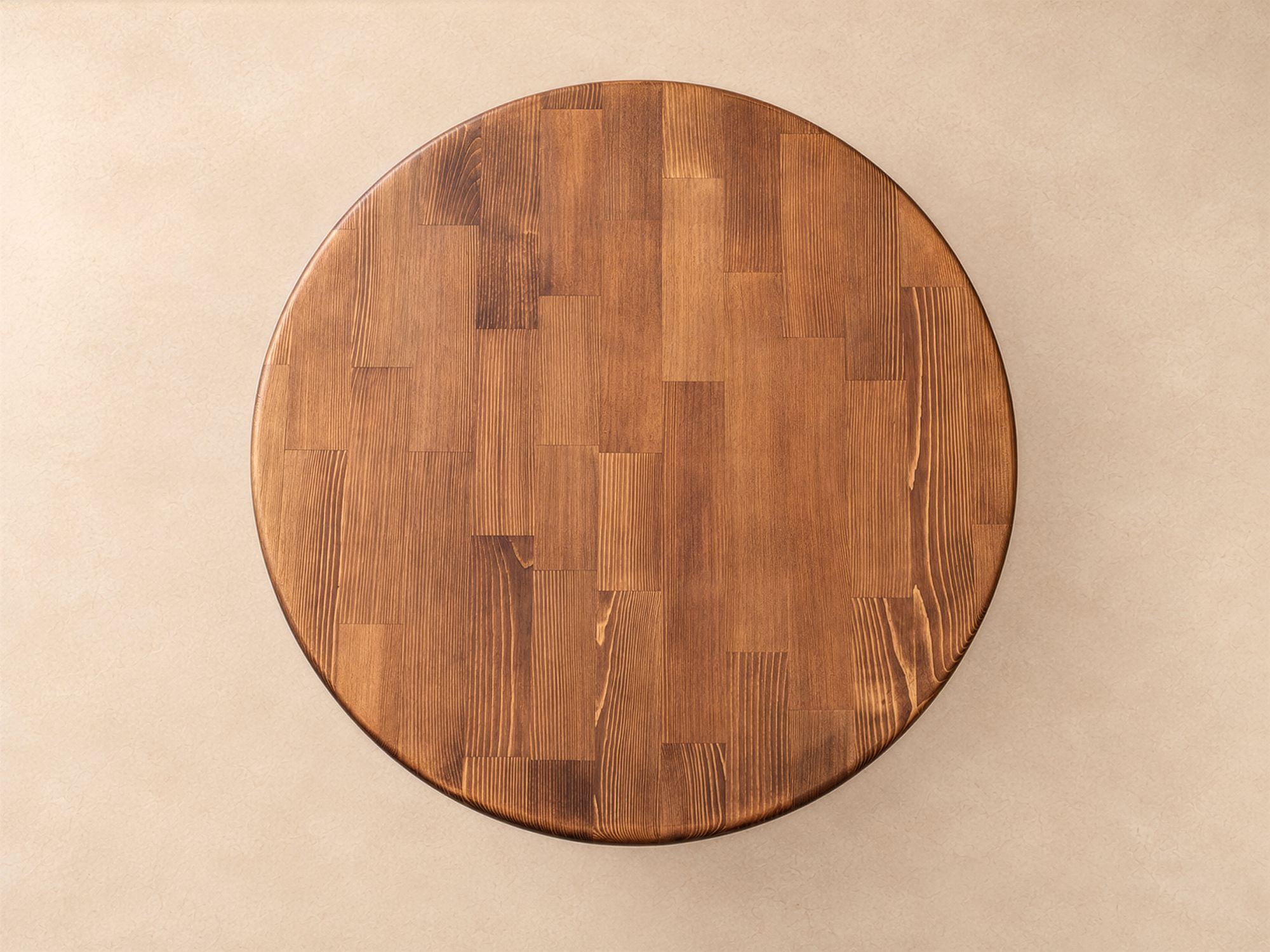 Vaha round solid wood coffee table with arched base, top view